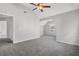 Spacious bedroom featuring vaulted ceiling, gray carpet, and bright windows at 6032 Trotters Cir, Fairburn, GA 30213