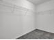 Walk-in closet features wire shelving and carpet at 6032 Trotters Cir, Fairburn, GA 30213