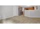Open-concept dining area and kitchen, with neutral color and stainless steel refrigerator at 6032 Trotters Cir, Fairburn, GA 30213