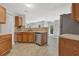 Kitchen with stainless steel appliances, neutral color, open to the backyard and living room at 6032 Trotters Cir, Fairburn, GA 30213