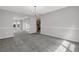 Open-concept living room and kitchen featuring gray carpeting at 6032 Trotters Cir, Fairburn, GA 30213