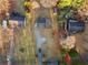 Drone view of the home showing the driveway, yard and other outbuildings at 1070 Kirkland Rd, Covington, GA 30016