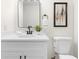 Modern bathroom featuring a white vanity, black faucet, and sleek mirror at 1070 Kirkland Rd, Covington, GA 30016