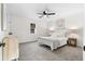 Bright bedroom with neutral tones, carpet, ceiling fan, and lots of natural light at 1070 Kirkland Rd, Covington, GA 30016