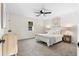 Bright bedroom with neutral tones, carpet, ceiling fan, and lots of natural light at 1070 Kirkland Rd, Covington, GA 30016