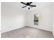 Neutral bedroom with a ceiling fan, a window that lets in the sun, and carpeted floor at 1070 Kirkland Rd, Covington, GA 30016