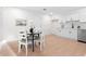 Eat-in kitchen with round table and seating. The space features white cabinets and wood floors at 1070 Kirkland Rd, Covington, GA 30016