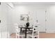 Cozy dining area with a round table, four chairs, and contemporary decor at 1070 Kirkland Rd, Covington, GA 30016