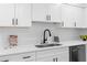 Kitchen area featuring stainless steel appliances, quartz countertops, sleek black hardware and decor at 1070 Kirkland Rd, Covington, GA 30016