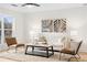 Comfortable living room featuring neutral decor, a plush rug, and stylish seating arrangements for relaxation at 1070 Kirkland Rd, Covington, GA 30016