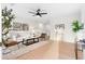 Bright living room with modern decor, light wood floors, ceiling fan and comfortable seating at 1070 Kirkland Rd, Covington, GA 30016