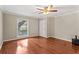 Empty bedroom with hardwood floors, a ceiling fan and a well-lit window at 1101 Collier Rd # K2, Atlanta, GA 30318