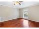 Bright, empty bedroom featuring hardwood floors, a ceiling fan and well-lit window at 1101 Collier Rd # K2, Atlanta, GA 30318