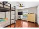 Bedroom with hardwood floors, ceiling fan, and a bunk bed at 1101 Collier Rd # K2, Atlanta, GA 30318