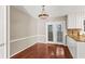 Bright dining area features hardwood floors, stylish light fixture and sliding doors to the exterior at 1101 Collier Rd # K2, Atlanta, GA 30318