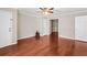 Spacious empty room featuring hardwood floors, neutral walls and multiple doorways at 1101 Collier Rd # K2, Atlanta, GA 30318