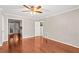Empty room featuring hardwood floors, neutral walls and doorway looking into the kitchen at 1101 Collier Rd # K2, Atlanta, GA 30318