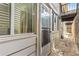 A view alongside the house that features windows, a door and a small balcony above the side pathway at 1101 Collier Rd # K2, Atlanta, GA 30318