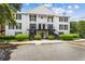 Inviting two-story building with manicured shrubs and mature trees at 1101 Collier Rd # K2, Atlanta, GA 30318
