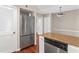 Well-equipped kitchen with stainless steel refrigerator, dishwasher, and stone countertops at 1101 Collier Rd # K2, Atlanta, GA 30318