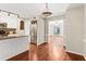 Open kitchen with stainless steel appliances, white cabinets and view to additional living space at 1101 Collier Rd # K2, Atlanta, GA 30318