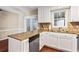 Efficient kitchen featuring white cabinets and granite countertops at 1101 Collier Rd # K2, Atlanta, GA 30318