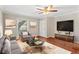Inviting living room featuring hardwood floors, modern decor, and a ceiling fan at 1101 Collier Rd # K2, Atlanta, GA 30318