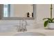 Modern bathroom featuring a polished faucet, sink with countertop space, and a large mirror at 146 Kingsley Way, Acworth, GA 30102