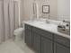 Bathroom featuring a gray vanity with a white countertop and modern fixtures at 146 Kingsley Way, Acworth, GA 30102