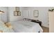 Cozy bedroom with white walls, a framed mirror, and decorative artwork, creating a serene atmosphere at 146 Kingsley Way, Acworth, GA 30102