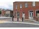 Exterior of old brick building with windows and doors needing renovation in downtown Acworth at 146 Kingsley Way, Acworth, GA 30102