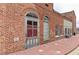 Vintage brick building facade with arched doorway, showing aged brick and historic architecture at 146 Kingsley Way, Acworth, GA 30102