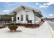 Charming white building with black trim, landscaped surroundings, and architectural character at 146 Kingsley Way, Acworth, GA 30102