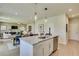 Open concept kitchen with granite countertops, stainless steel appliances, and adjacent dining area at 146 Kingsley Way, Acworth, GA 30102