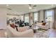 Inviting living room with bright and open layout with modern furniture and decor flowing into the dining and kitchen area at 146 Kingsley Way, Acworth, GA 30102