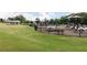 Community playground with climbing structures and shaded picnic tables at 146 Kingsley Way, Acworth, GA 30102
