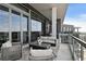 Outdoor balcony features comfortable seating with city views at 3107 Peachtree Ne Rd # 2003 Aka Ph3, Atlanta, GA 30305