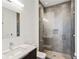 Modern bathroom with a glass-enclosed shower, tiled walls, and contemporary fixtures at 3107 Peachtree Ne Rd # 2003 Aka Ph3, Atlanta, GA 30305