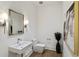 Chic powder room featuring contemporary fixtures, stylish decor, and modern lighting at 3107 Peachtree Ne Rd # 2003 Aka Ph3, Atlanta, GA 30305