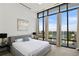Inviting bedroom with large windows offering panoramic city views and comfortable furnishings at 3107 Peachtree Ne Rd # 2003 Aka Ph3, Atlanta, GA 30305
