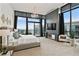 Bright bedroom with floor-to-ceiling windows, modern decor, and a cozy seating area at 3107 Peachtree Ne Rd # 2003 Aka Ph3, Atlanta, GA 30305