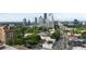 Expansive cityscape view with modern buildings and lush green trees, offering a vibrant urban living experience at 3107 Peachtree Ne Rd # 2003 Aka Ph3, Atlanta, GA 30305