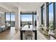 Bright, airy dining room featuring floor-to-ceiling windows and a modern aesthetic at 3107 Peachtree Ne Rd # 2003 Aka Ph3, Atlanta, GA 30305