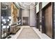 Hallway with marble walls, decorative lighting, and access to modern elevators at 3107 Peachtree Ne Rd # 2003 Aka Ph3, Atlanta, GA 30305