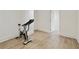 Home fitness room featuring a stationary exercise bike with wood floors at 3107 Peachtree Ne Rd # 2003 Aka Ph3, Atlanta, GA 30305