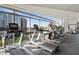 Bright gym with modern equipment and floor to ceiling windows that features beautiful city views at 3107 Peachtree Ne Rd # 2003 Aka Ph3, Atlanta, GA 30305