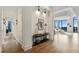 Hallway with art display leading into a bright and open living space with floor to ceiling windows at 3107 Peachtree Ne Rd # 2003 Aka Ph3, Atlanta, GA 30305