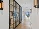 Elegant hallway with modern lighting and a striking glass-paneled door, showcasing contemporary design elements at 3107 Peachtree Ne Rd # 2003 Aka Ph3, Atlanta, GA 30305