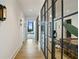 Elegant hallway with hardwood floors, modern light fixtures, and a peek into the living spaces at 3107 Peachtree Ne Rd # 2003 Aka Ph3, Atlanta, GA 30305