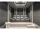 A home theater features comfortable seating for four, a large screen TV, and recessed lighting at 3107 Peachtree Ne Rd # 2003 Aka Ph3, Atlanta, GA 30305